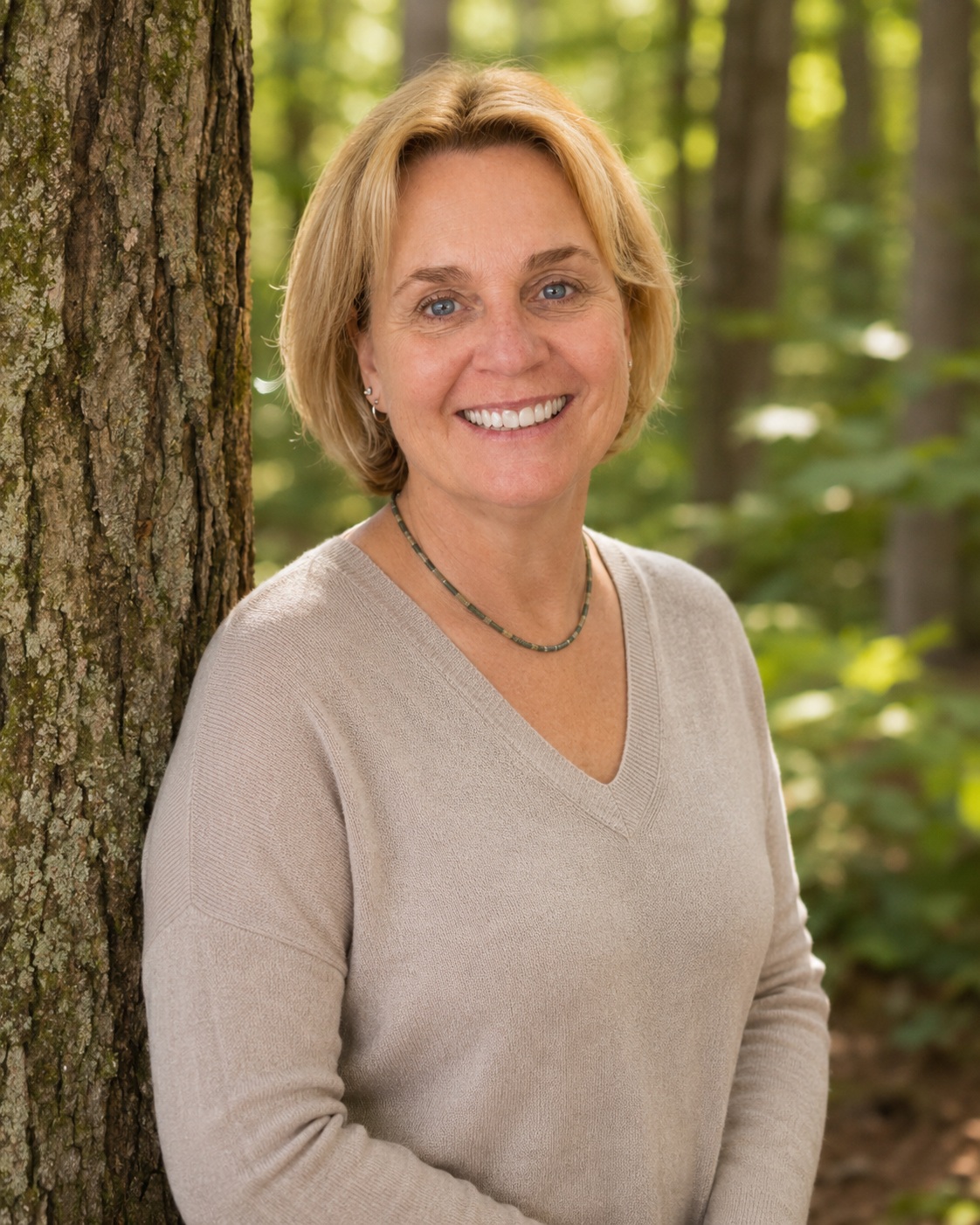 Author Melissa Leigh Clarke in the woods